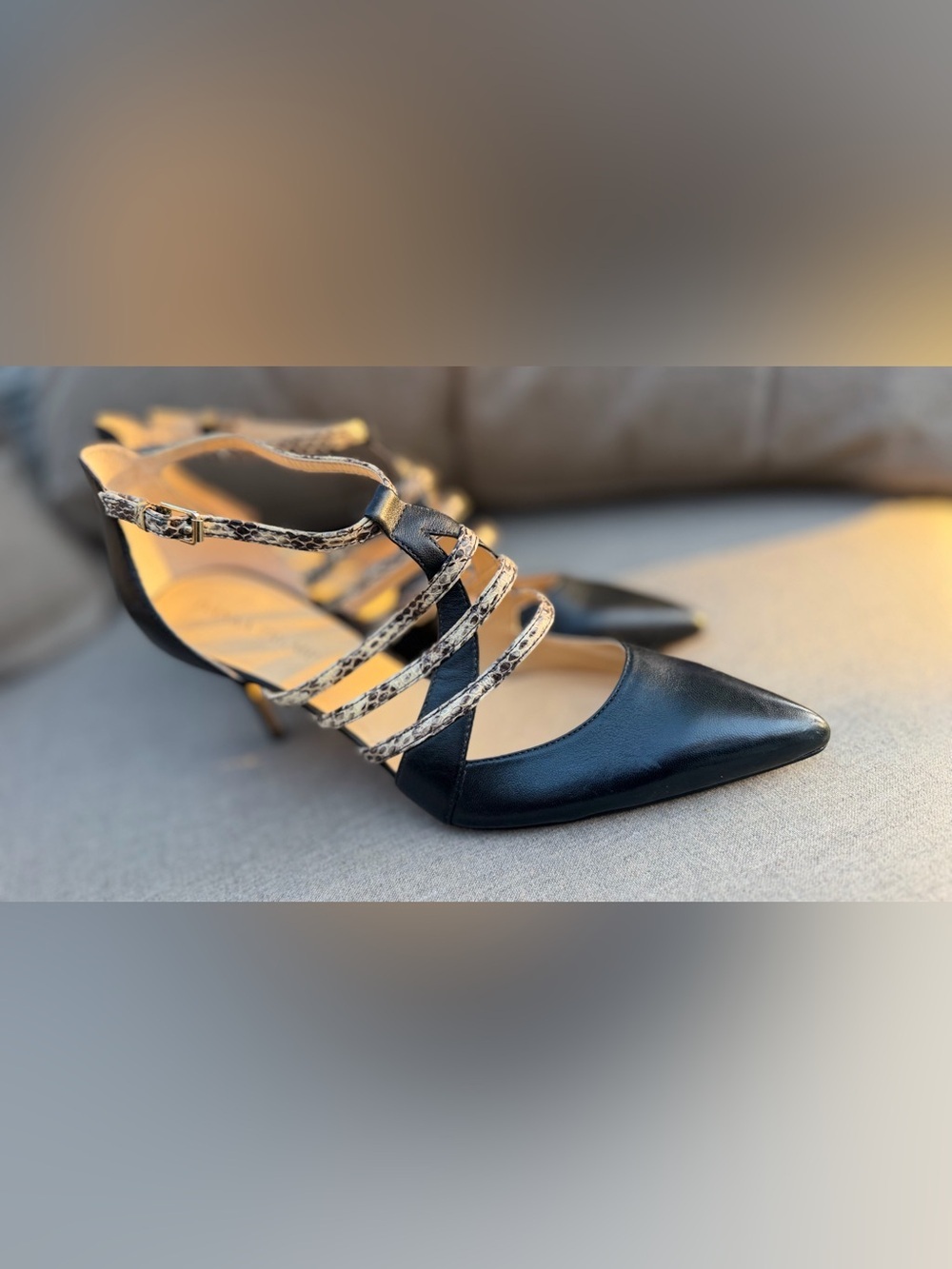 Ivanka Trump brand black heels featuring snakeskin-patterned straps. Size 9.5